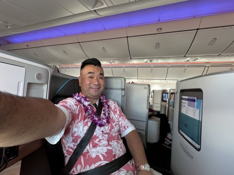 a man taking a selfie in an airplane