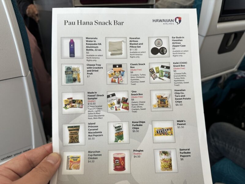 a hand holding a menu