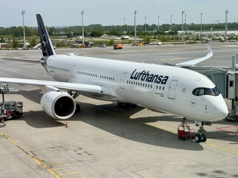 a white airplane on a runway