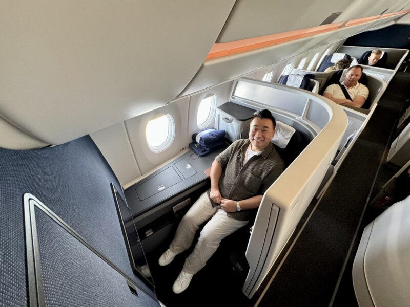 a group of men sitting in a plane