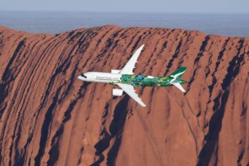a plane flying over a mountain