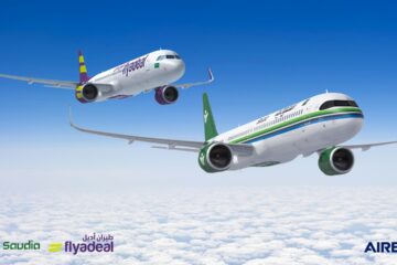 two airplanes flying in the sky