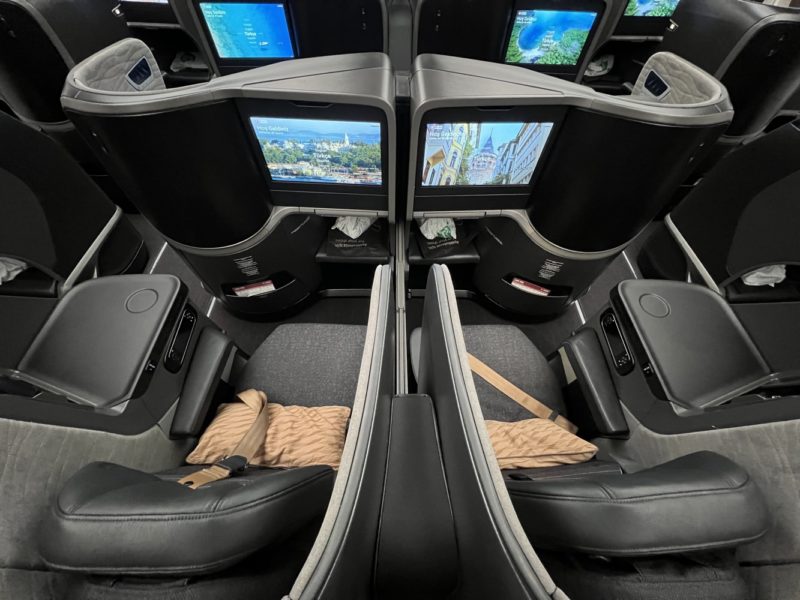 the seats with monitors in the back