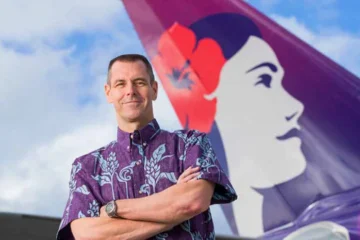 a man standing in front of a plane
